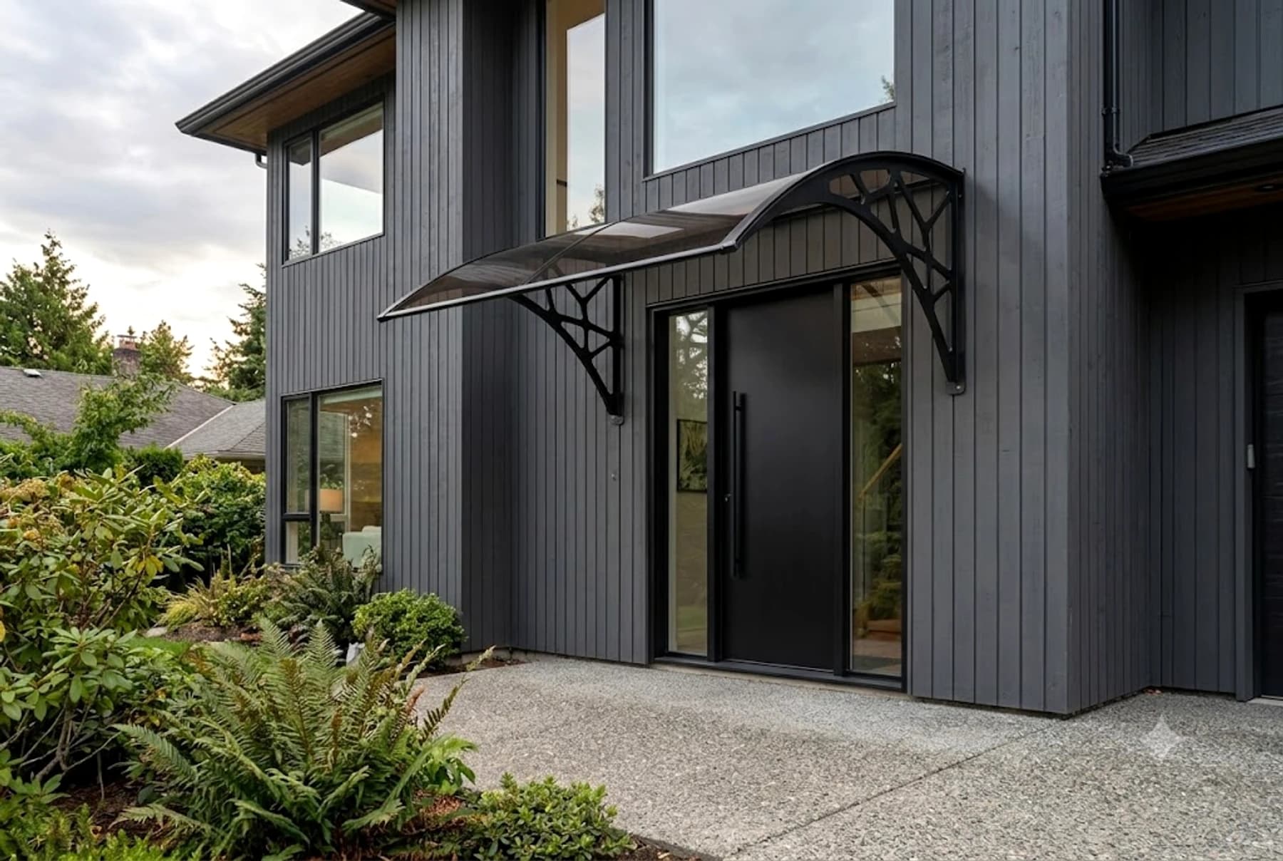 Charcoal modern home with a Richport awning